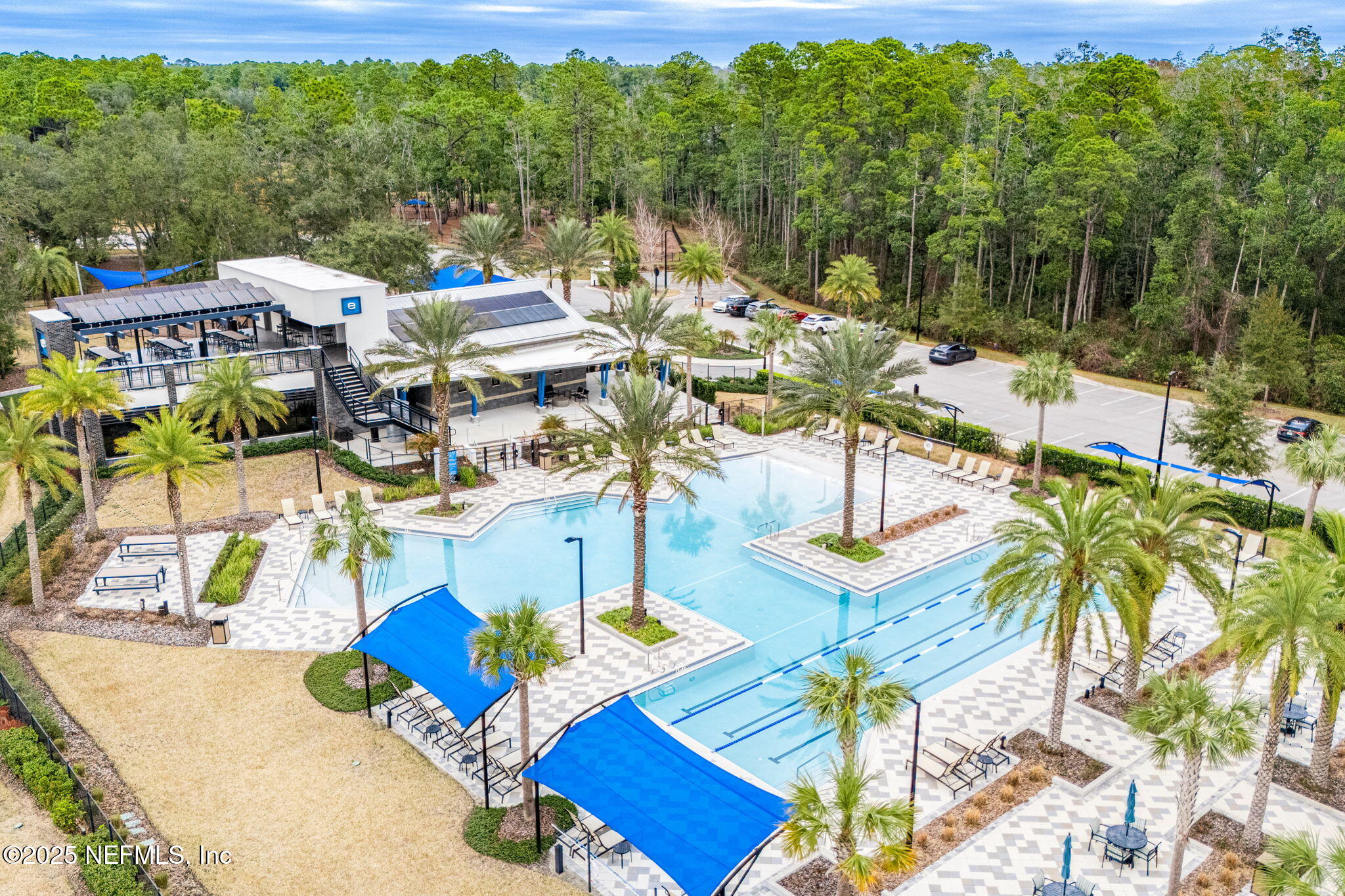 9918 Filament Boulevard Jacksonville, FL 32256 - Photo 102 of 106 a view of an chairs and tables in the patio