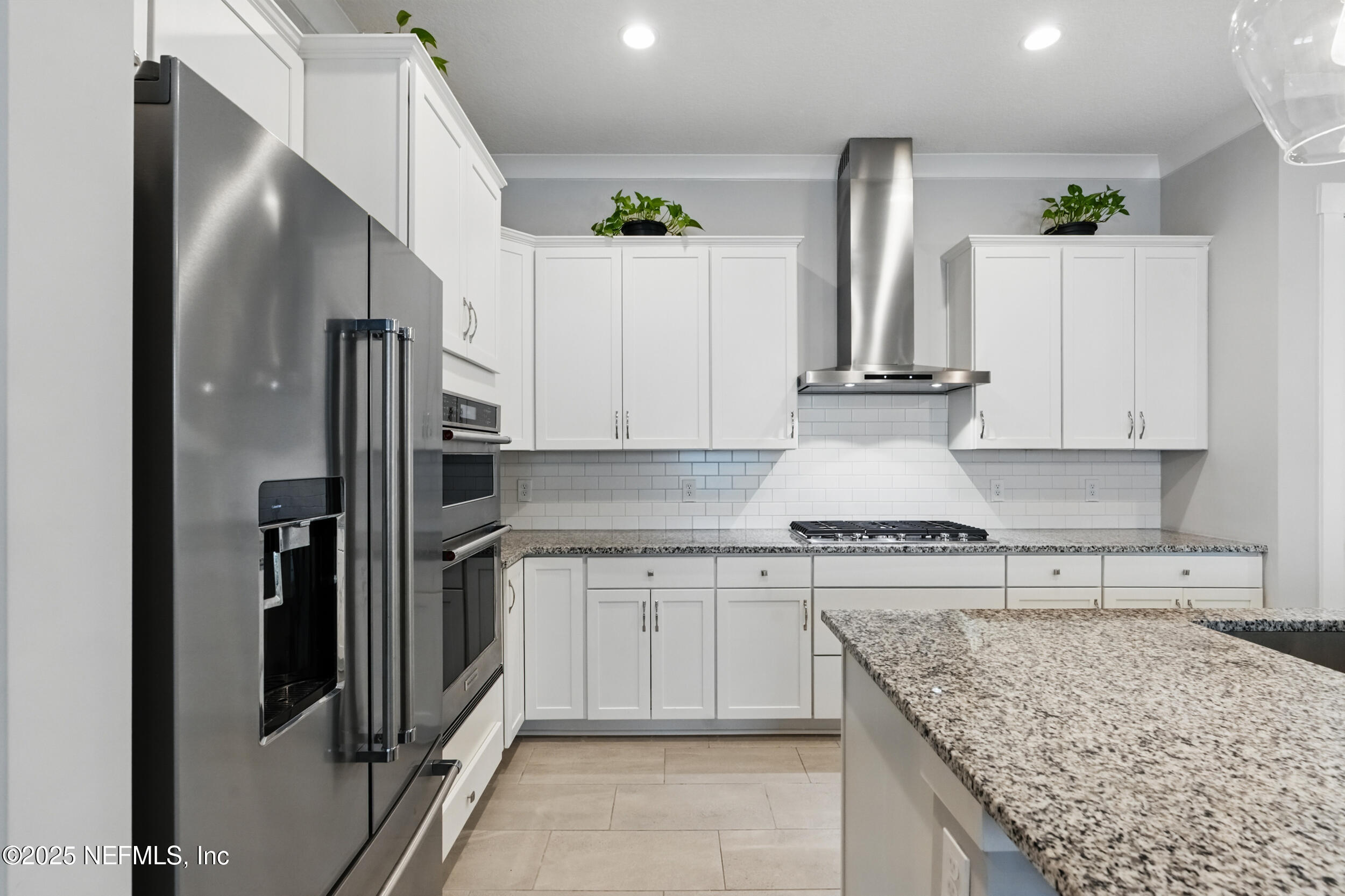 9918 Filament Boulevard Jacksonville, FL 32256 - Photo 12 of 106 a kitchen with stainless steel appliances granite countertop a refrigerator sink and stove