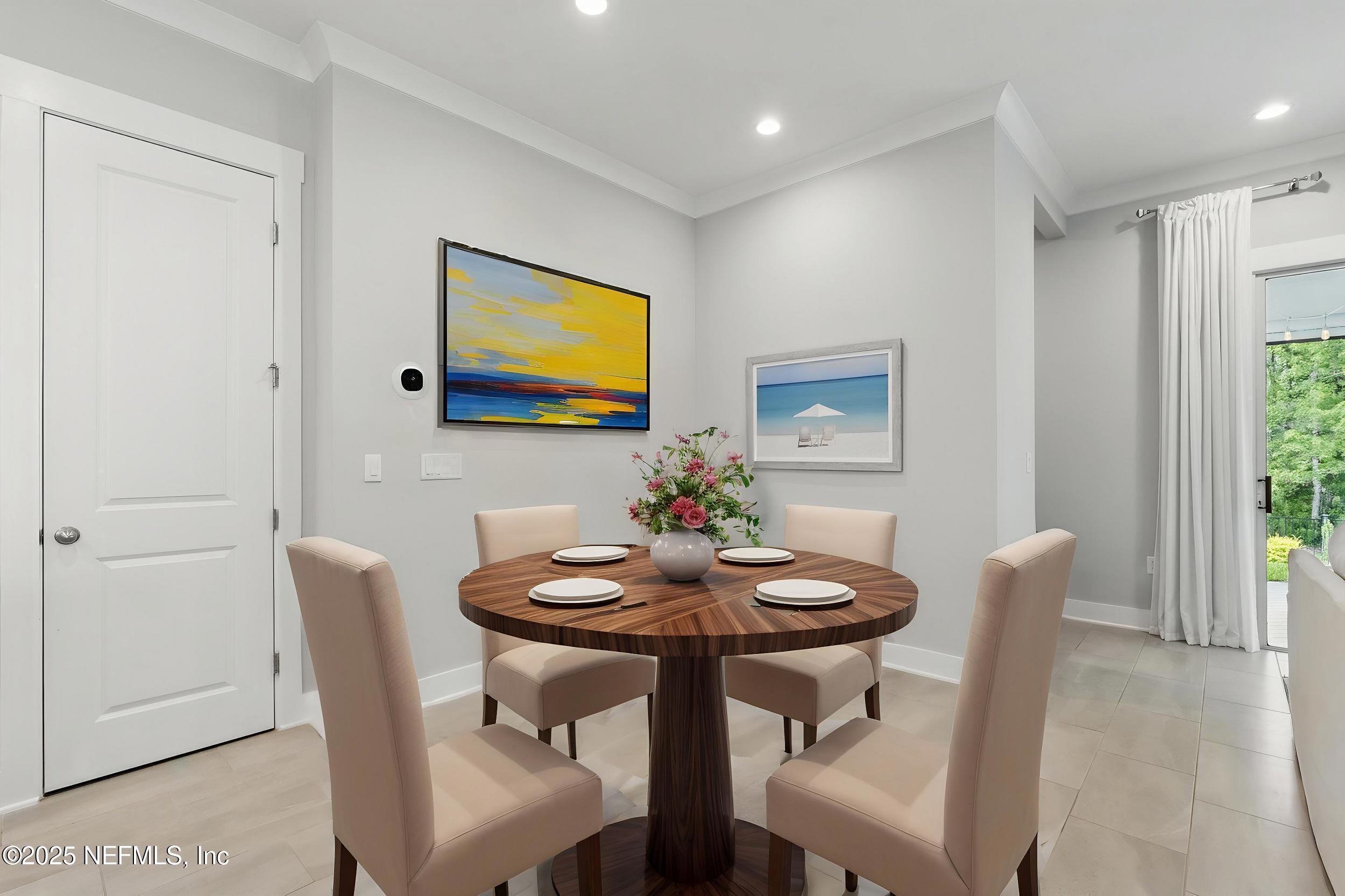 9918 Filament Boulevard Jacksonville, FL 32256 - Photo 22 of 106 a view of a dining room with furniture and wooden floor