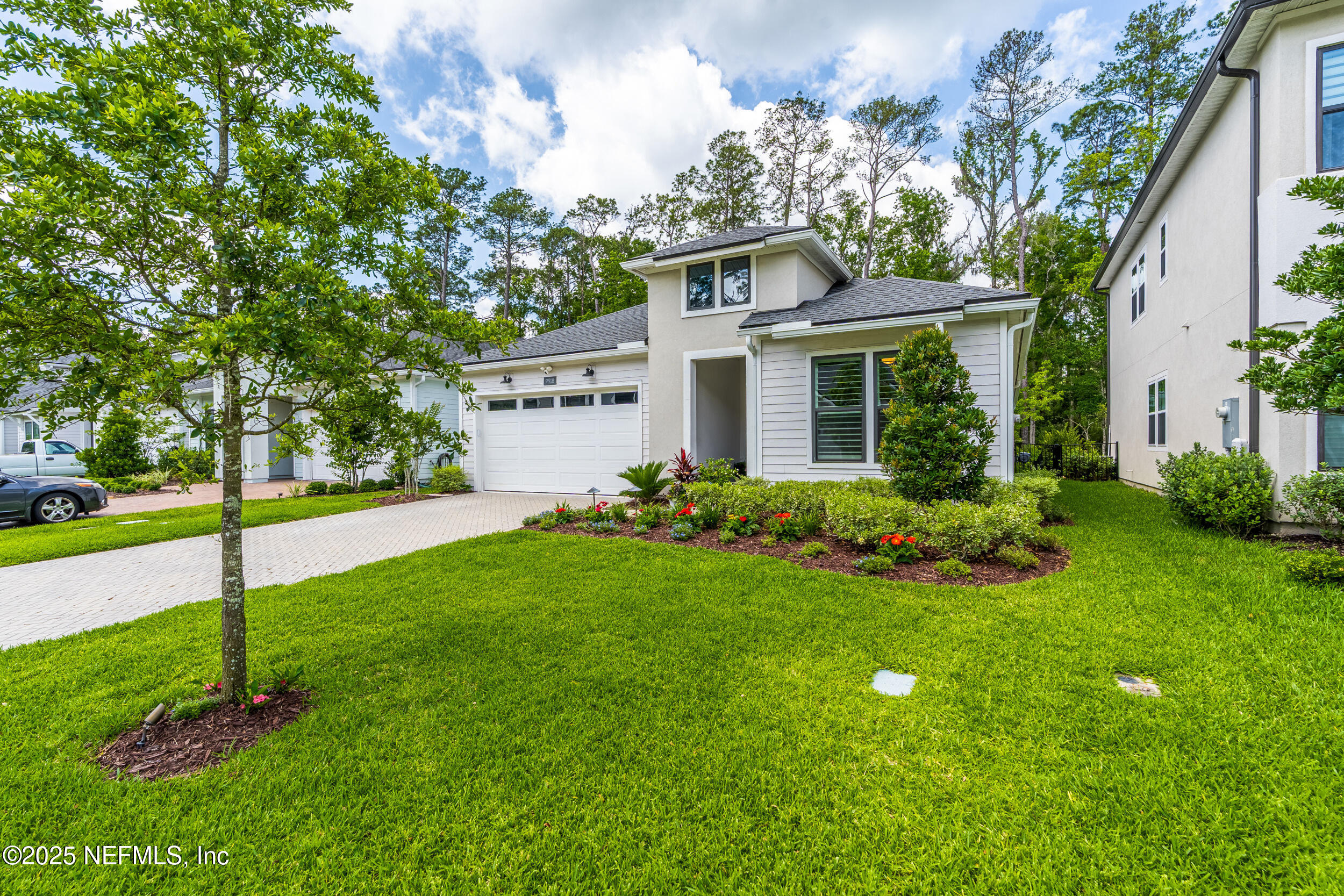 9918 Filament Boulevard Jacksonville, FL 32256 - Photo 3 of 106 a front view of house with yard and green space