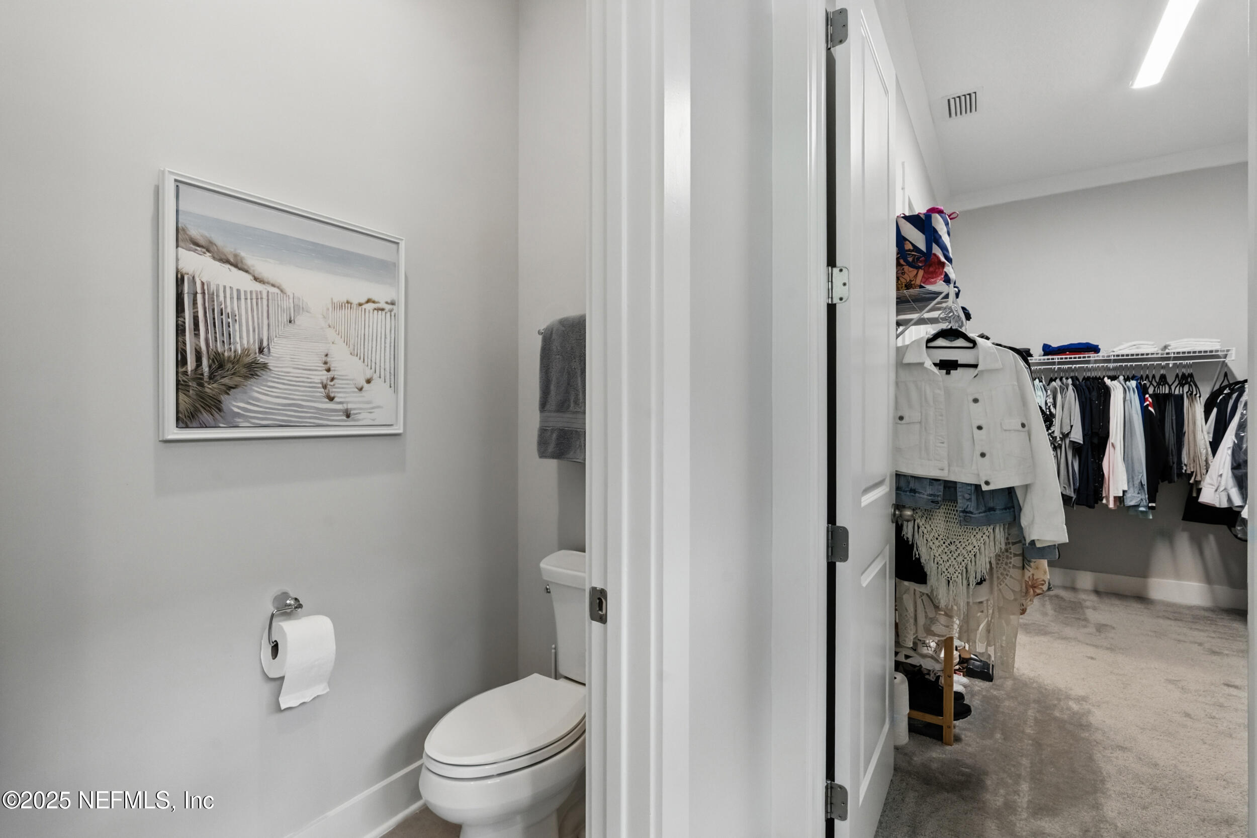 9918 Filament Boulevard Jacksonville, FL 32256 - Photo 36 of 106 a bathroom with a toilet and a shower
