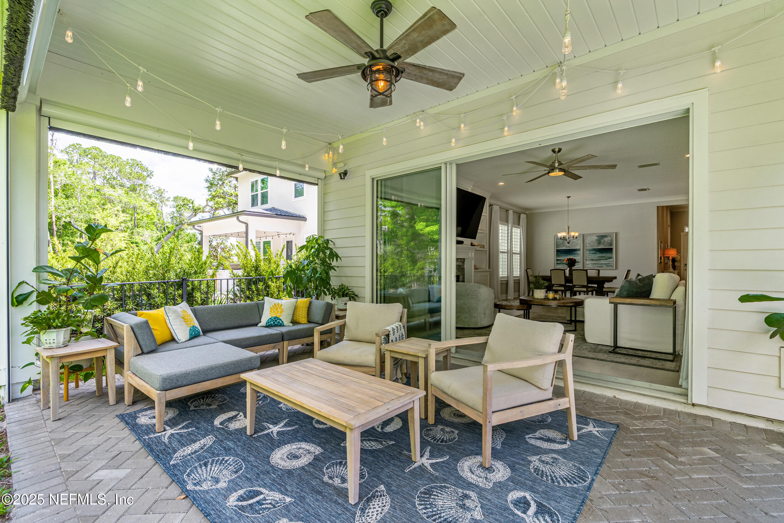 9918 Filament Boulevard Jacksonville, FL 32256 - Photo 47 of 106 a living room with patio a table and a potted plant