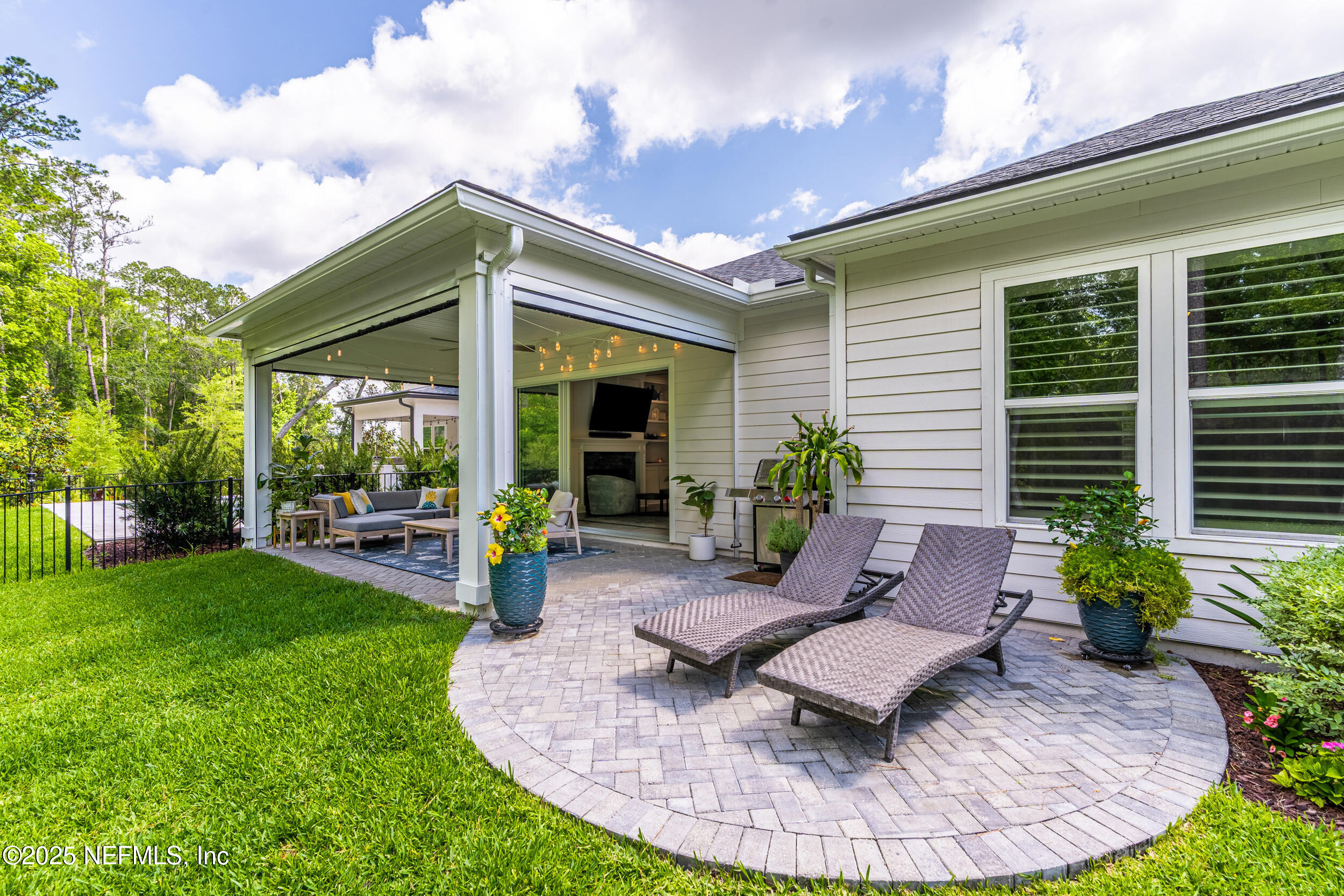 9918 Filament Boulevard Jacksonville, FL 32256 - Photo 50 of 106 a view of a house with backyard sitting area and garden