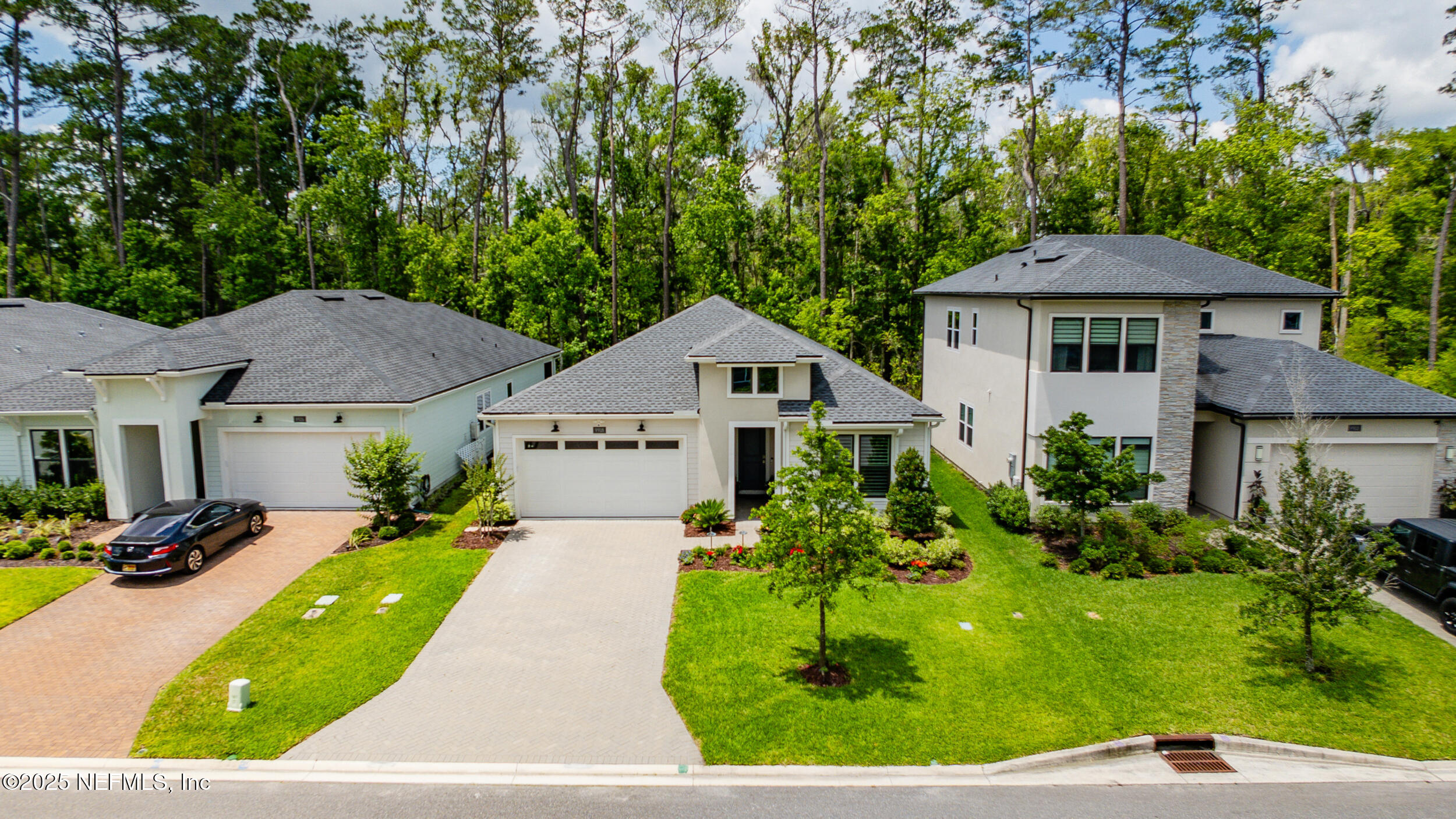9918 Filament Boulevard Jacksonville, FL 32256 - Photo 5 of 106 a front view of a house with a yard