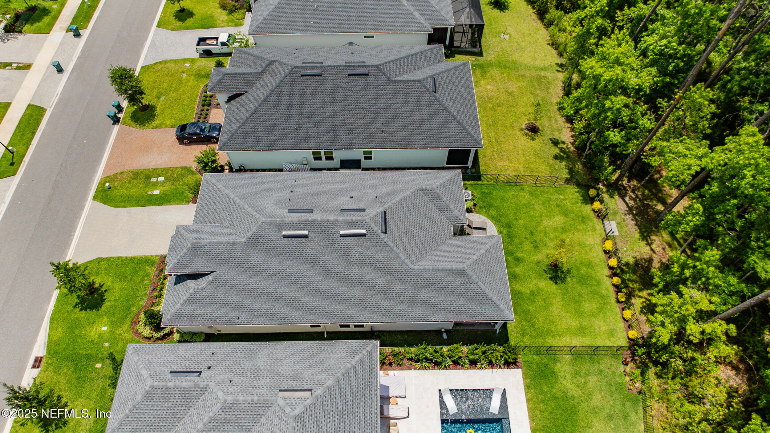 9918 Filament Boulevard Jacksonville, FL 32256 - Photo 54 of 106 an aerial view of a house with swimming pool and garden