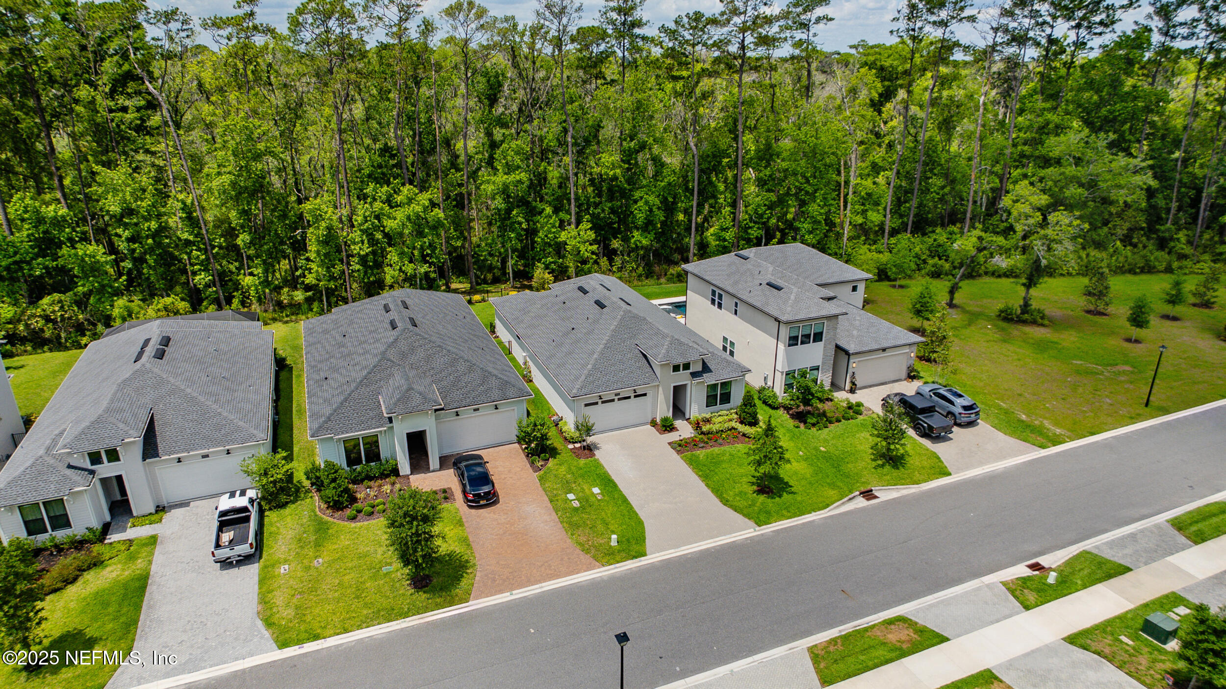9918 Filament Boulevard Jacksonville, FL 32256 - Photo 59 of 106 an aerial view of multiple houses with a yard