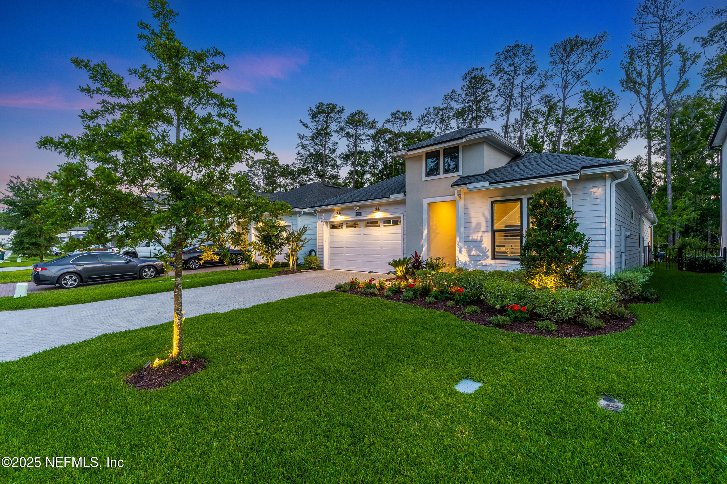 9918 Filament Boulevard Jacksonville, FL 32256 - Photo 71 of 106 a house view with a garden space