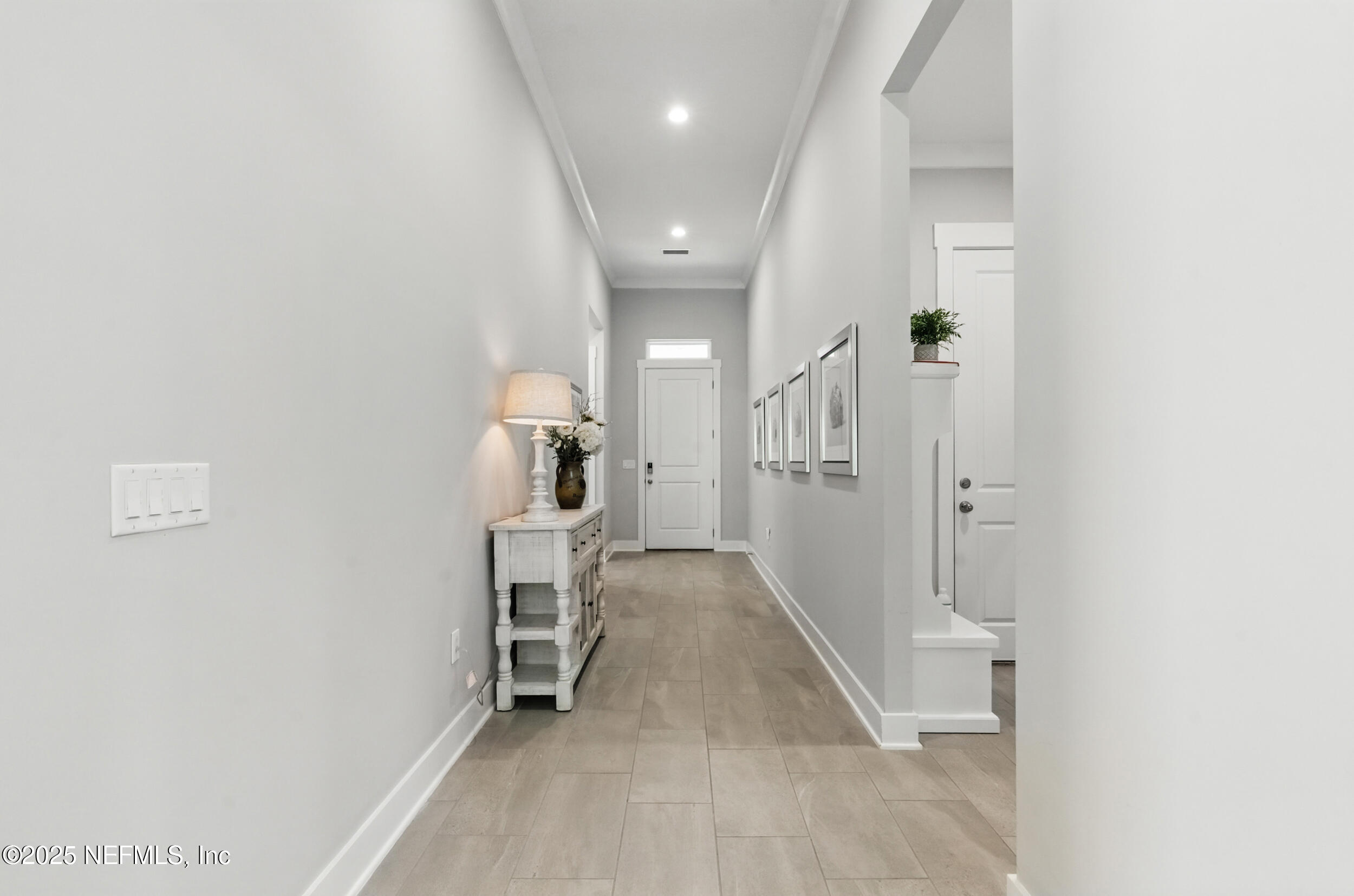 9918 Filament Boulevard Jacksonville, FL 32256 - Photo 8 of 106 a view of a hallway with a livingroom and stairs