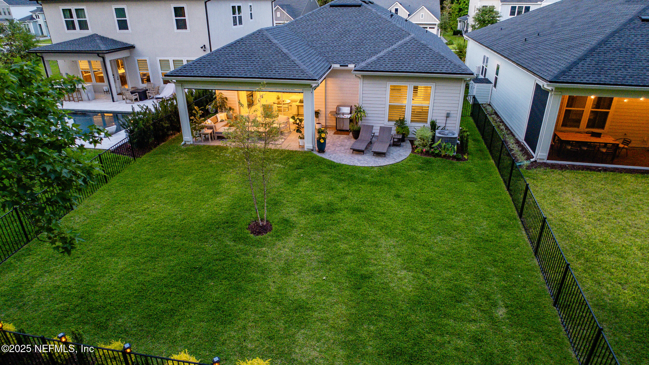 9918 Filament Boulevard Jacksonville, FL 32256 - Photo 82 of 106 a view of a house with a backyard patio and sitting area