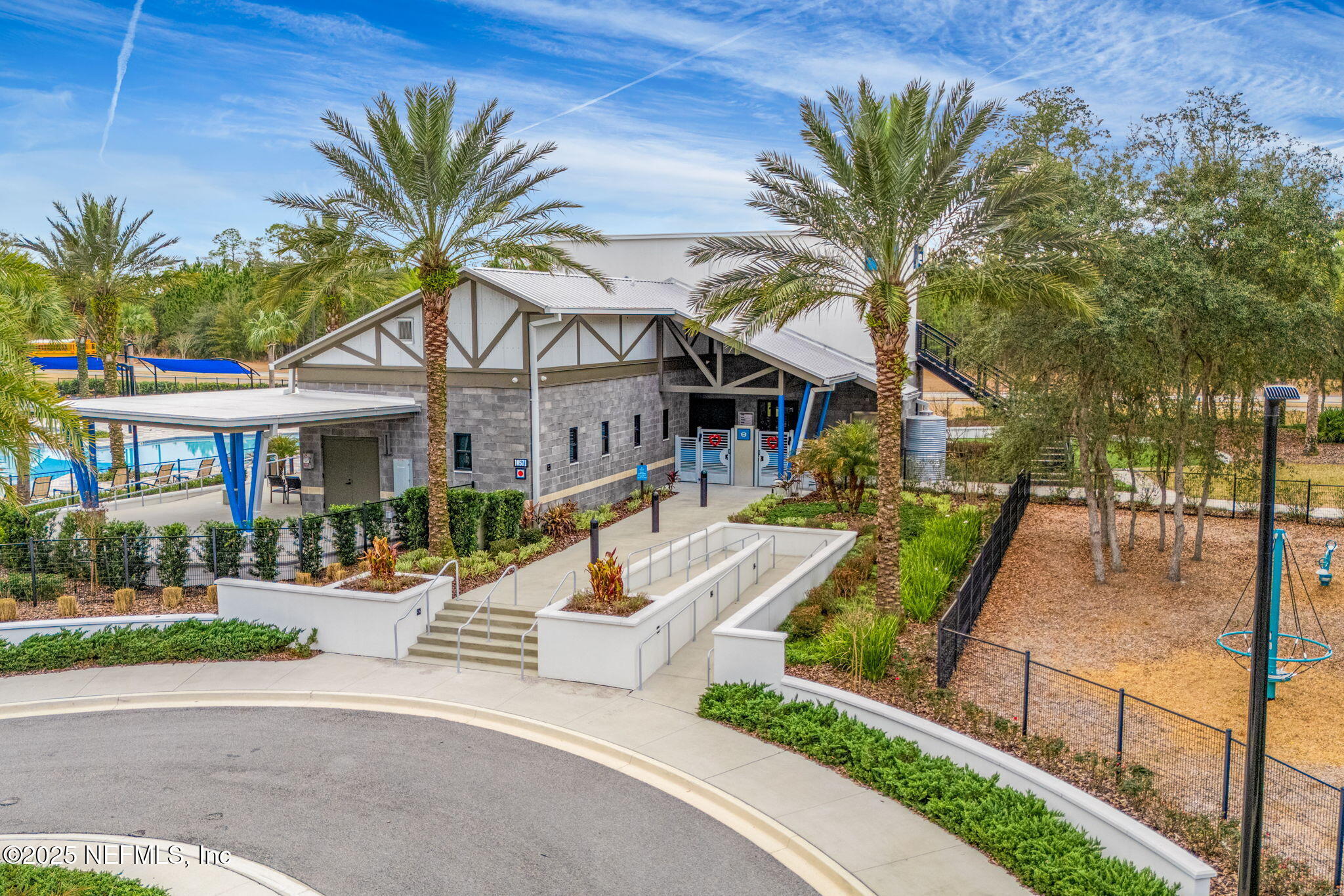 9918 Filament Boulevard Jacksonville, FL 32256 - Photo 89 of 106 a front view of a house with a yard garage and outdoor seating