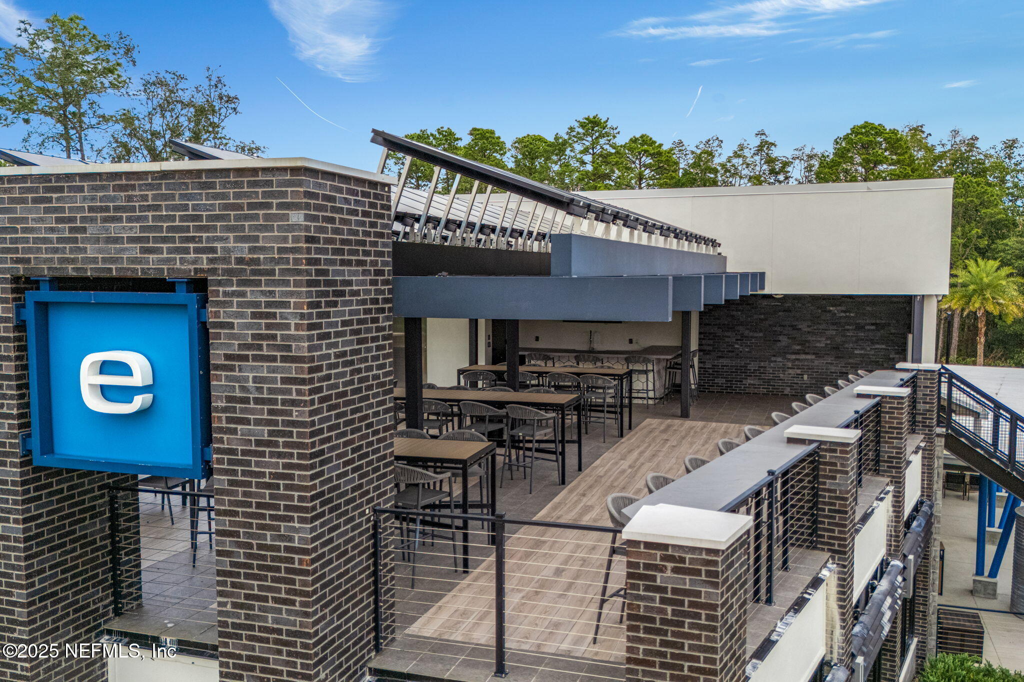 9918 Filament Boulevard Jacksonville, FL 32256 - Photo 94 of 106 a view of a patio with a table and chairs