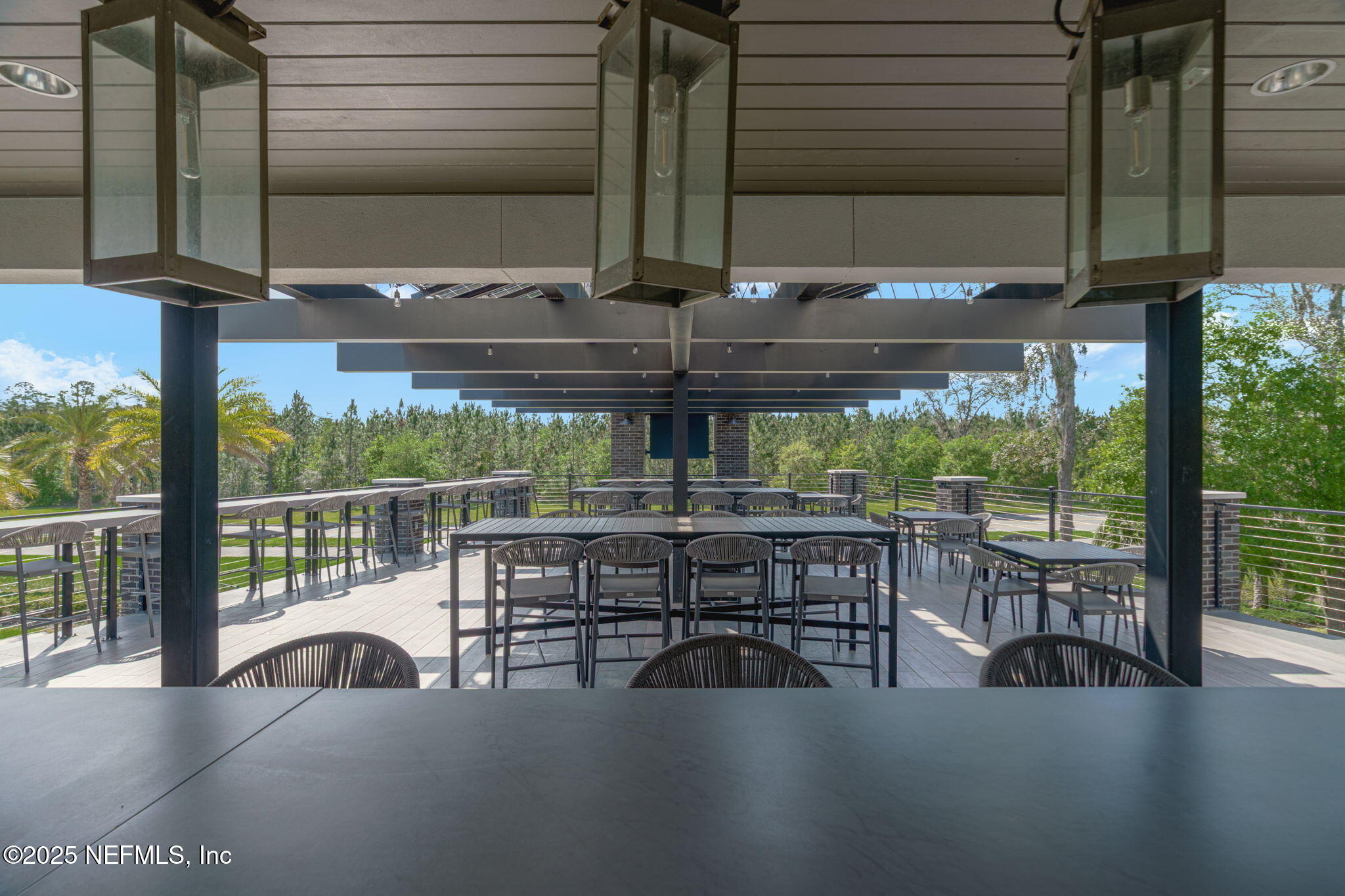 9918 Filament Boulevard Jacksonville, FL 32256 - Photo 96 of 106 a view of a patio with a table chairs and wooden fence