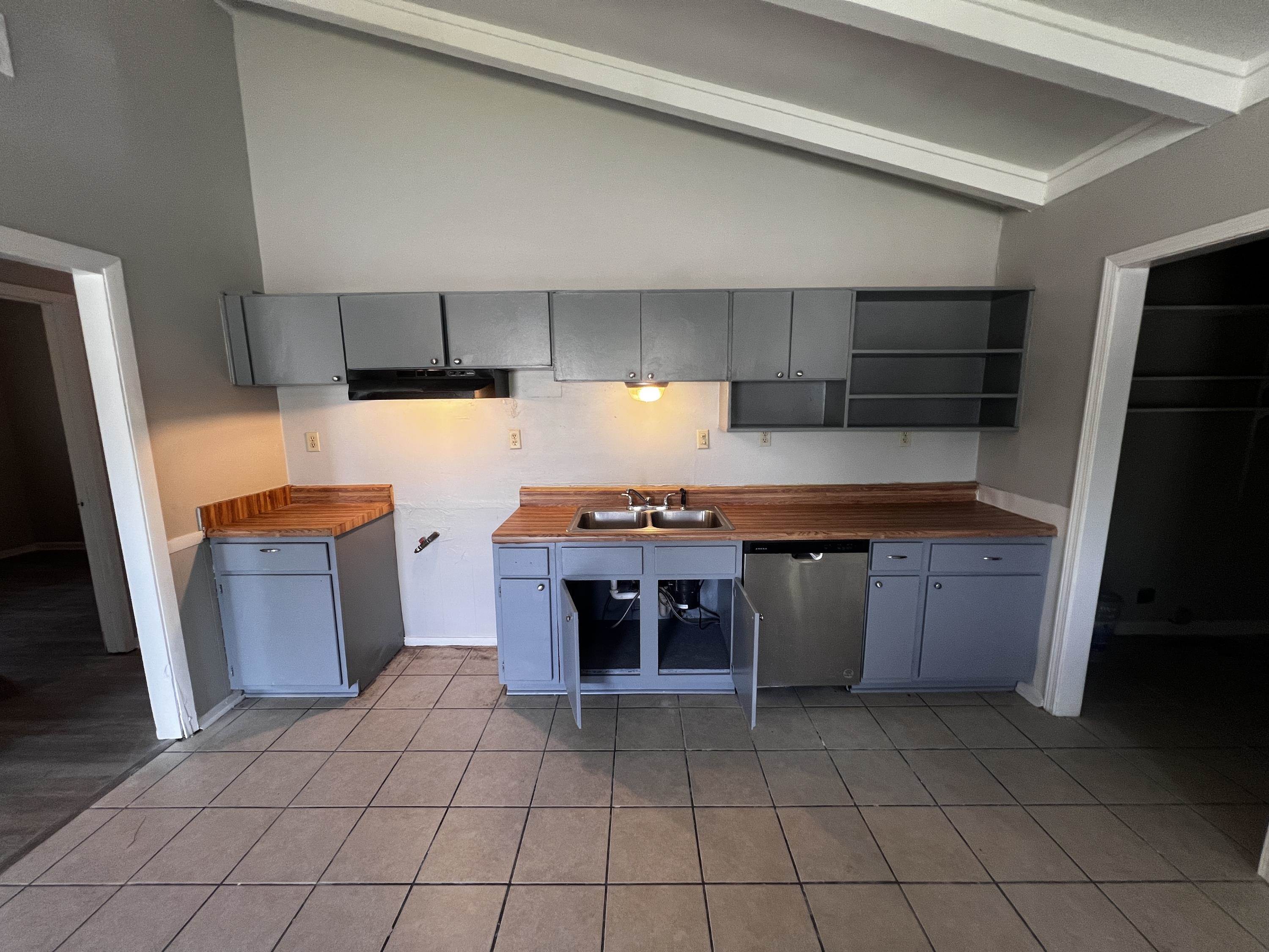 4523 Lawrence Road Memphis, TN 38122 - Photo 4 of 11 a kitchen with a refrigerator and a stove