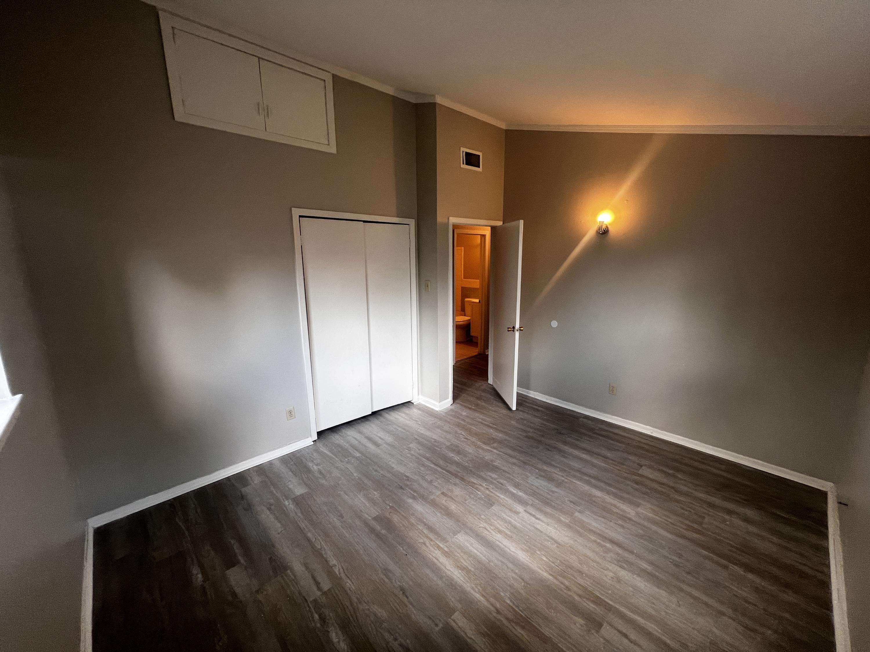 4523 Lawrence Road Memphis, TN 38122 - Photo 8 of 11 an empty room with wooden floor and windows