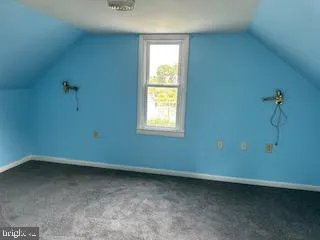 a view of a room that has a window in it