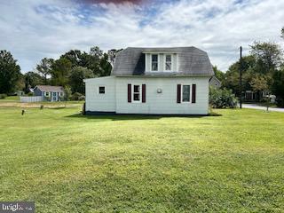 6343 Bozman Neavitt Road Neavitt, MD 21652 - Photo 18 of 23 a front view of a house with a garden