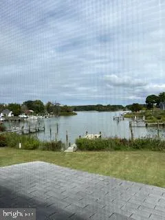 a view of a lake with houses in the back