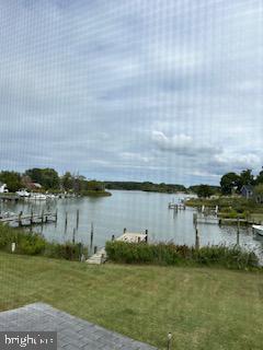 6343 Bozman Neavitt Road Neavitt, MD 21652 - Photo 22 of 23 a view of a lake with houses in the back