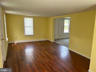 6343 Bozman Neavitt Road Neavitt, MD 21652 - Photo 5 of 23 a view of empty room with wooden floor and fan