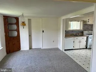 a view of a kitchen cabinets and a wooden floor