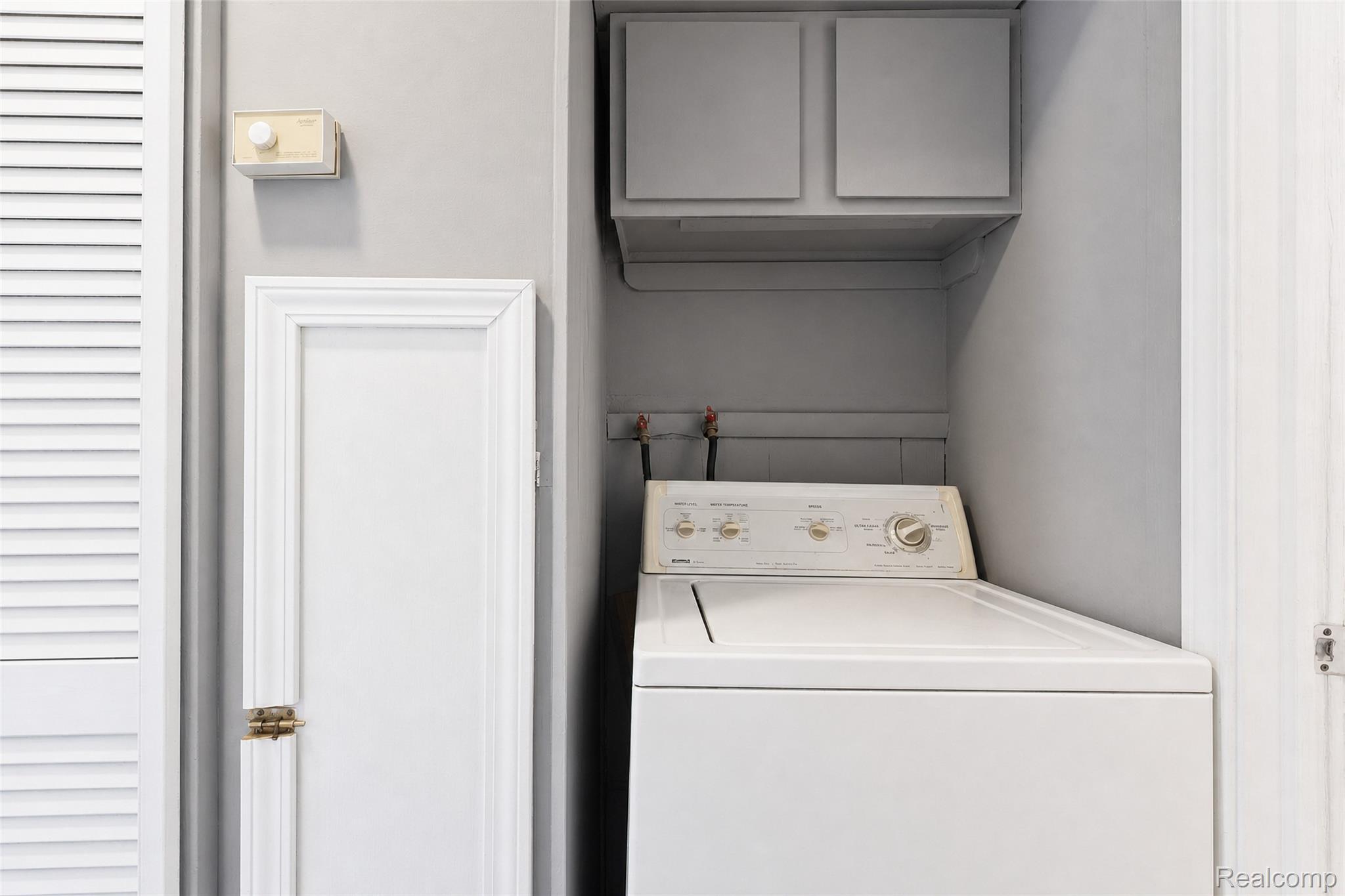 26137 Superior Road Taylor, MI 48180 - Photo 24 of 34 Laundry area with built-in cabinetry and painted walls