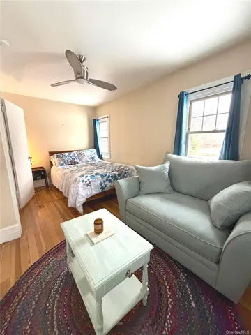 a living room with furniture and a window