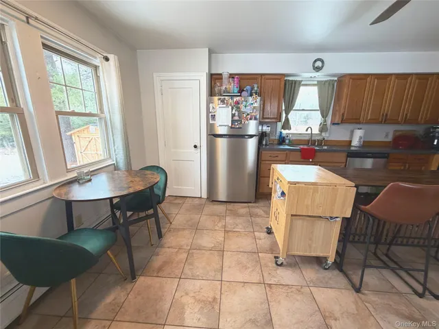a kitchen with a table and chairs