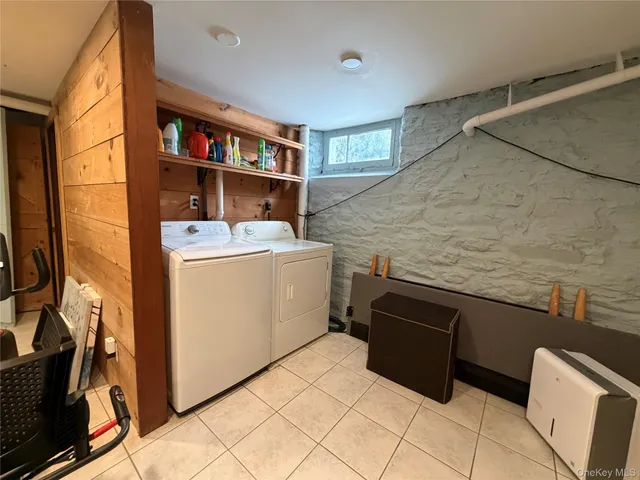 a view of storage and utility room with washer and dryer