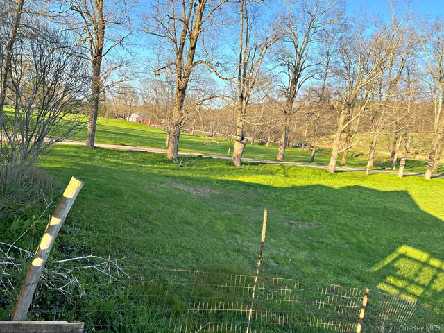 a view of a house with a big yard