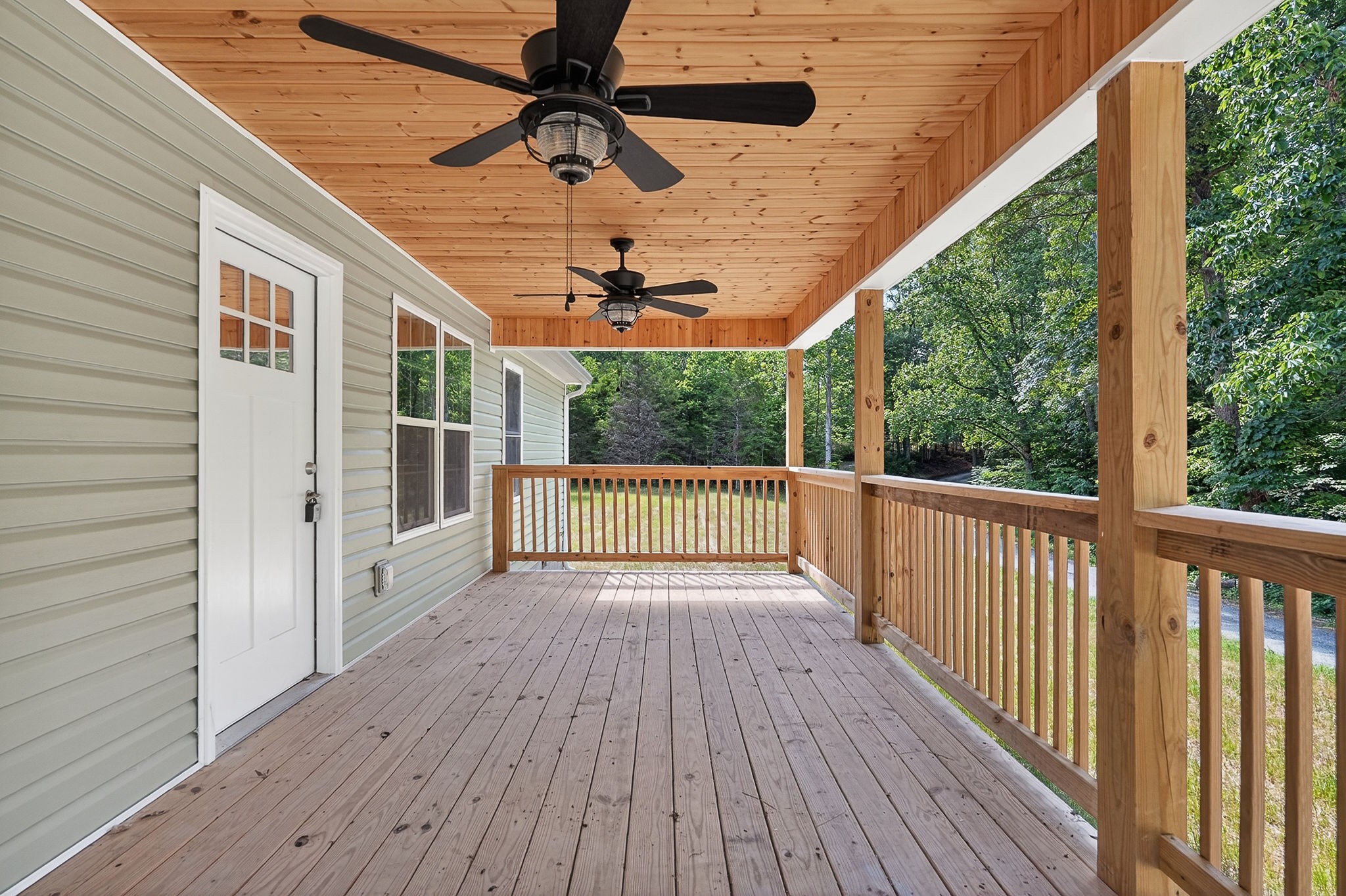 1053 Benton Tidwell Road Hilham, TN 38568 - Photo 29 of 39 a view of a balcony with wooden floor
