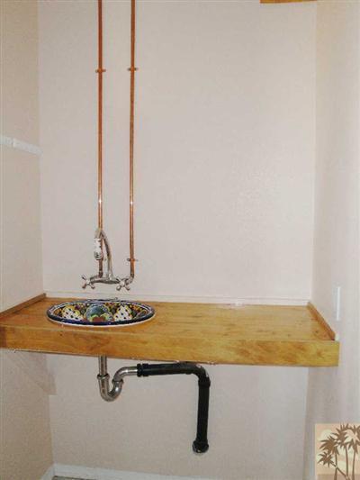 6620 Outpost Road Joshua Tree, CA 92252 - Photo 11 of 24 a view of a terrace with a sink