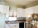 6620 Outpost Road Joshua Tree, CA 92252 - Photo 21 of 24 a kitchen with granite countertop a sink and cabinets