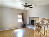 6620 Outpost Road Joshua Tree, CA 92252 - Photo 23 of 24 a view of a livingroom with a fireplace and a window