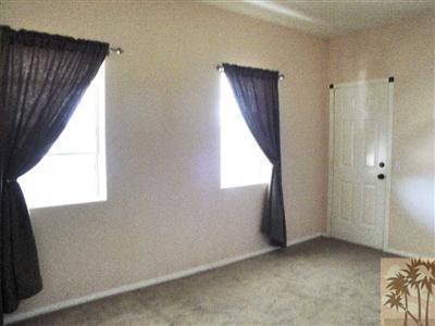 6620 Outpost Road Joshua Tree, CA 92252 - Photo 8 of 24 an empty room with windows