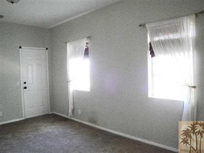 6620 Outpost Road Joshua Tree, CA 92252 - Photo 9 of 24 an empty room with windows and closet
