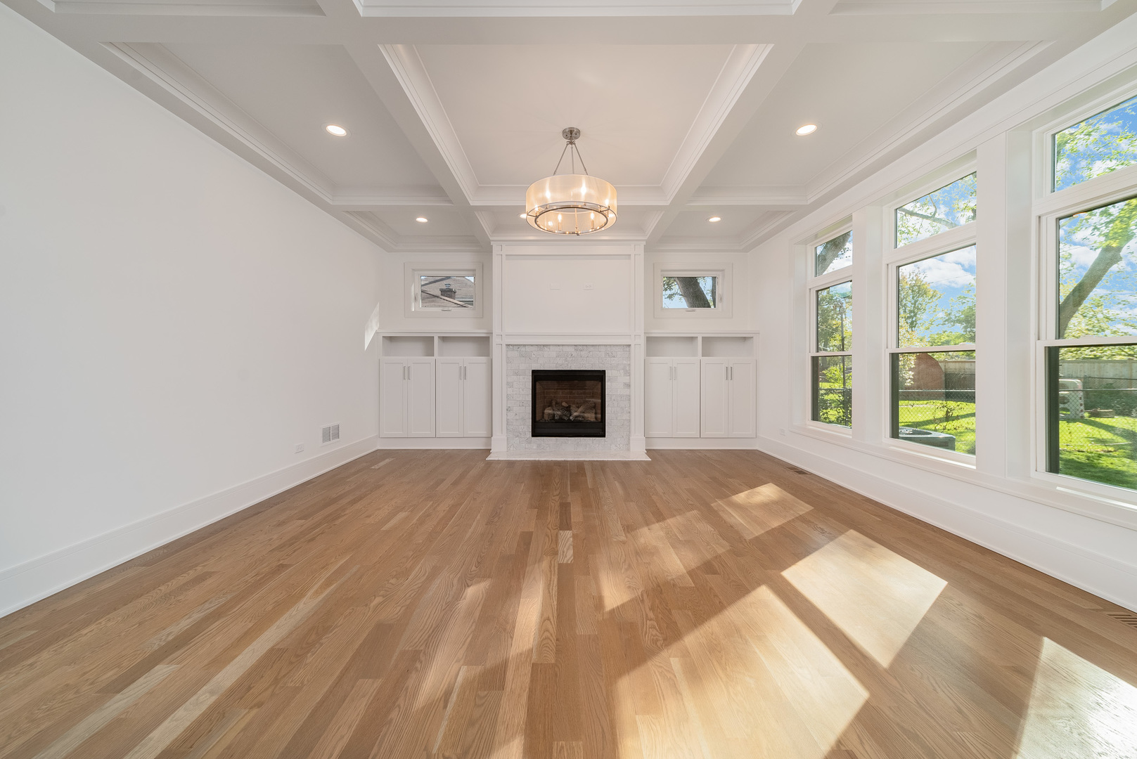 315 Walnut Street Elmhurst, IL 60126 - Photo 9 of 39 a view of an empty room with a fireplace and a window