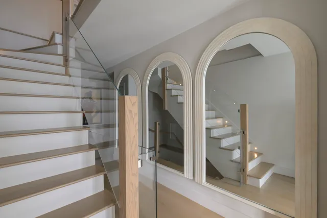a large kitchen with kitchen island a stove a sink and a refrigerator