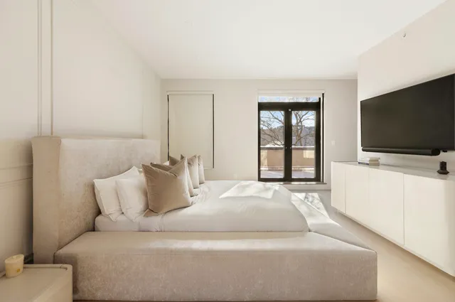 a large kitchen with lots of counter top space and dining table