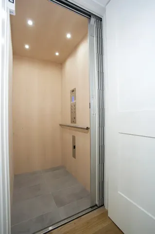 a spacious bathroom with a granite countertop tub sink and next to a window