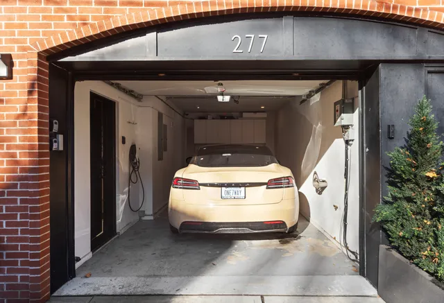 a kitchen with kitchen island a counter top space stainless steel appliances and a window