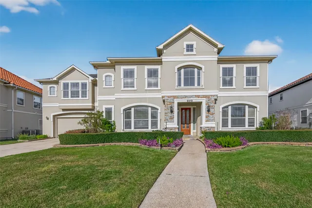 a front view of a house with a yard and porch