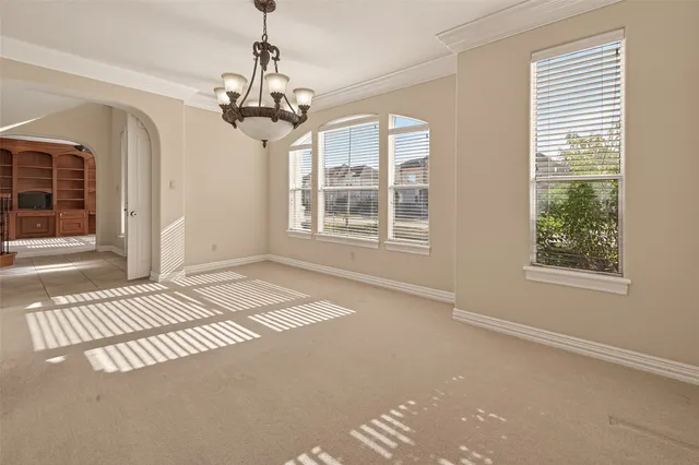a white bath tub sitting next to a shower