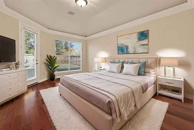 a bedroom with bed and wall painting