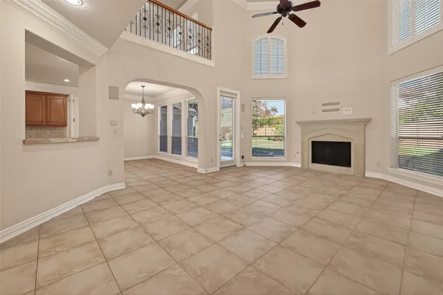 a dining room with furniture potted plants and wooden floor