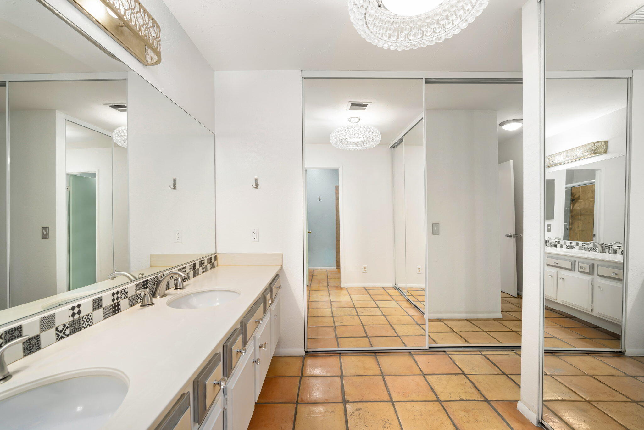 1783 Ramon Road, Unit 2 Palm Springs, CA 92264 - Photo 12 of 18 a spacious bathroom with a sink a mirror and a shower