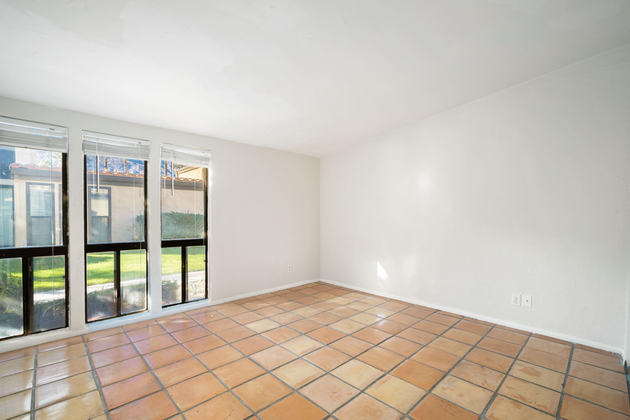 1783 Ramon Road, Unit 2 Palm Springs, CA 92264 - Photo 13 of 18 a view of an empty room and window