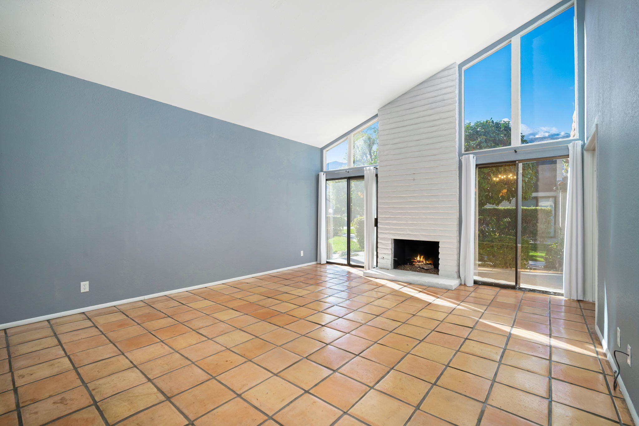 1783 Ramon Road, Unit 2 Palm Springs, CA 92264 - Photo 5 of 18 a view of a livingroom with a fireplace