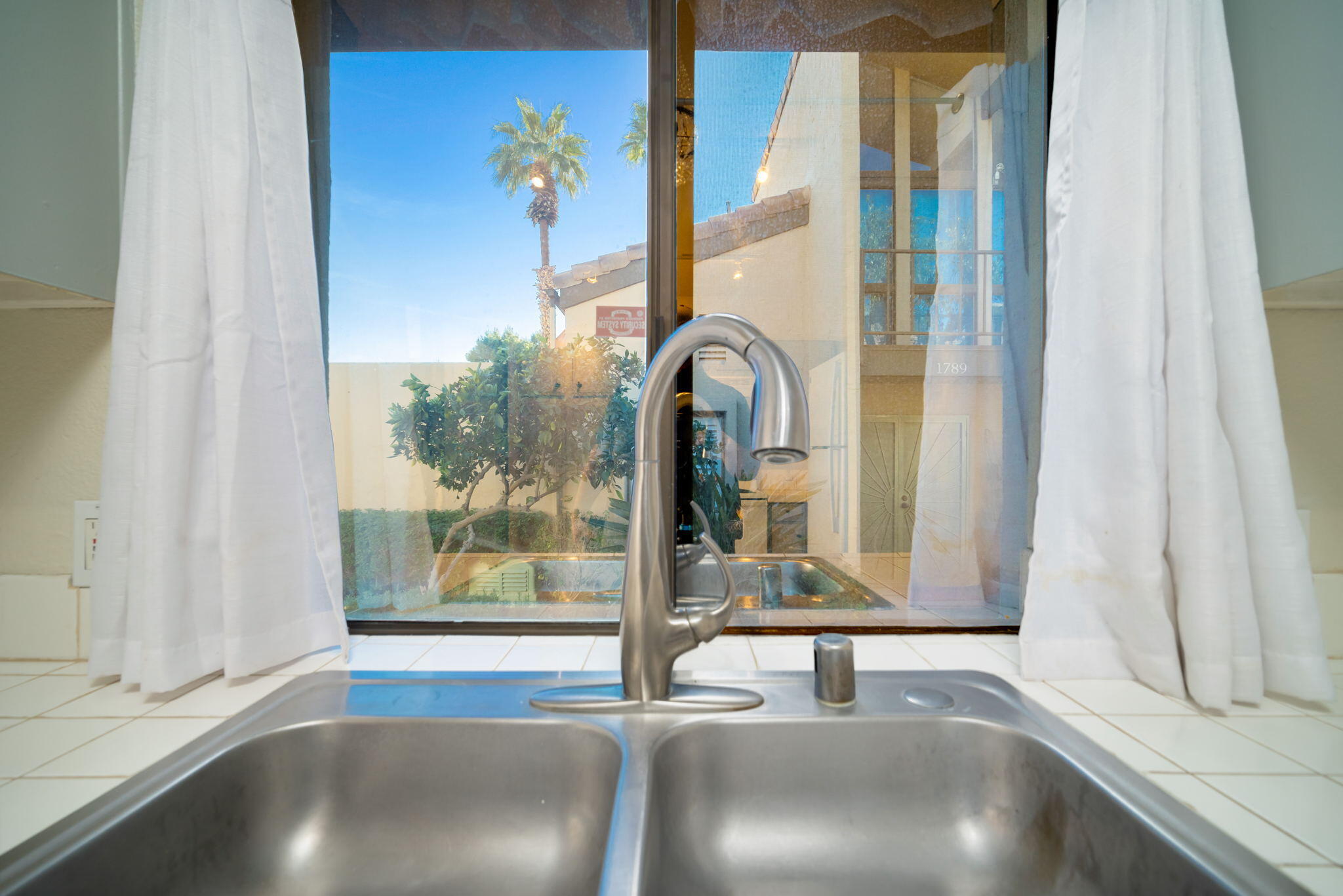 1783 Ramon Road, Unit 2 Palm Springs, CA 92264 - Photo 8 of 18 a view of a room with a floor to ceiling window