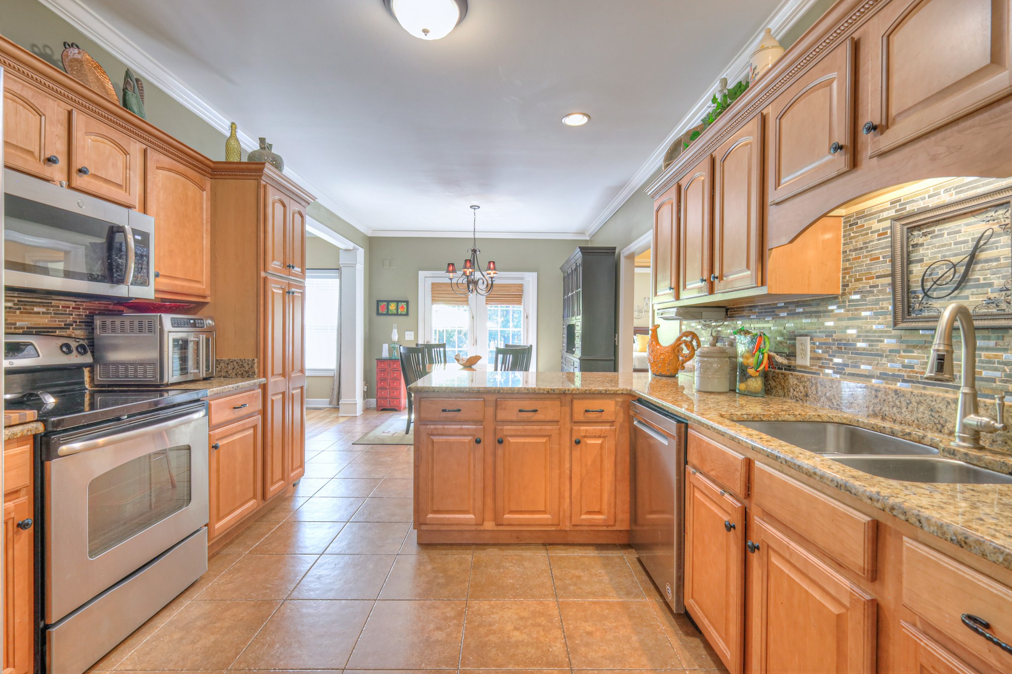 431 Conquest Road Murfreesboro, TN 37128 - Photo 12 of 55 a large kitchen with stainless steel appliances granite countertop a large stove top oven a sink and dishwasher