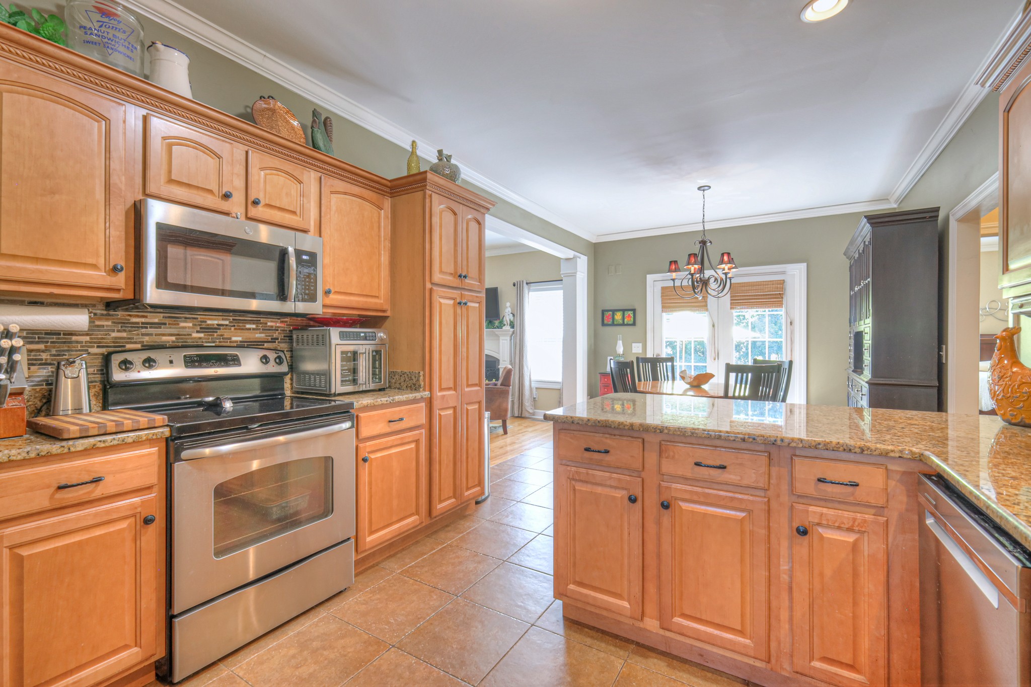 431 Conquest Road Murfreesboro, TN 37128 - Photo 14 of 55 a kitchen with stainless steel appliances granite countertop a stove and cabinets
